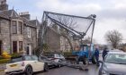 Cricket net on cars on Cranford Road