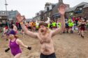 A mad run to the cold water at Stonehaven Harbour. Image: Kami Thomson/DC Thomson