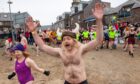 A mad run to the cold water at Stonehaven Harbour. Image: Kami Thomson/DC Thomson