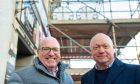 Picture shows Our Union Street leader Bob Keiller and Robin Miller on Union Street while workers return the clock to the old Bruce Millers shop front.