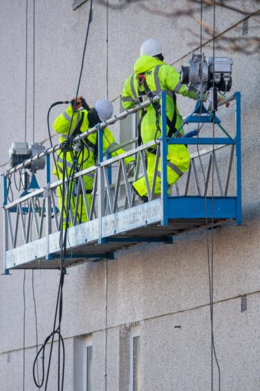 The teams spray-cleaning the high-rise will soon be replaced by an artist well versed in creating giant works of art.