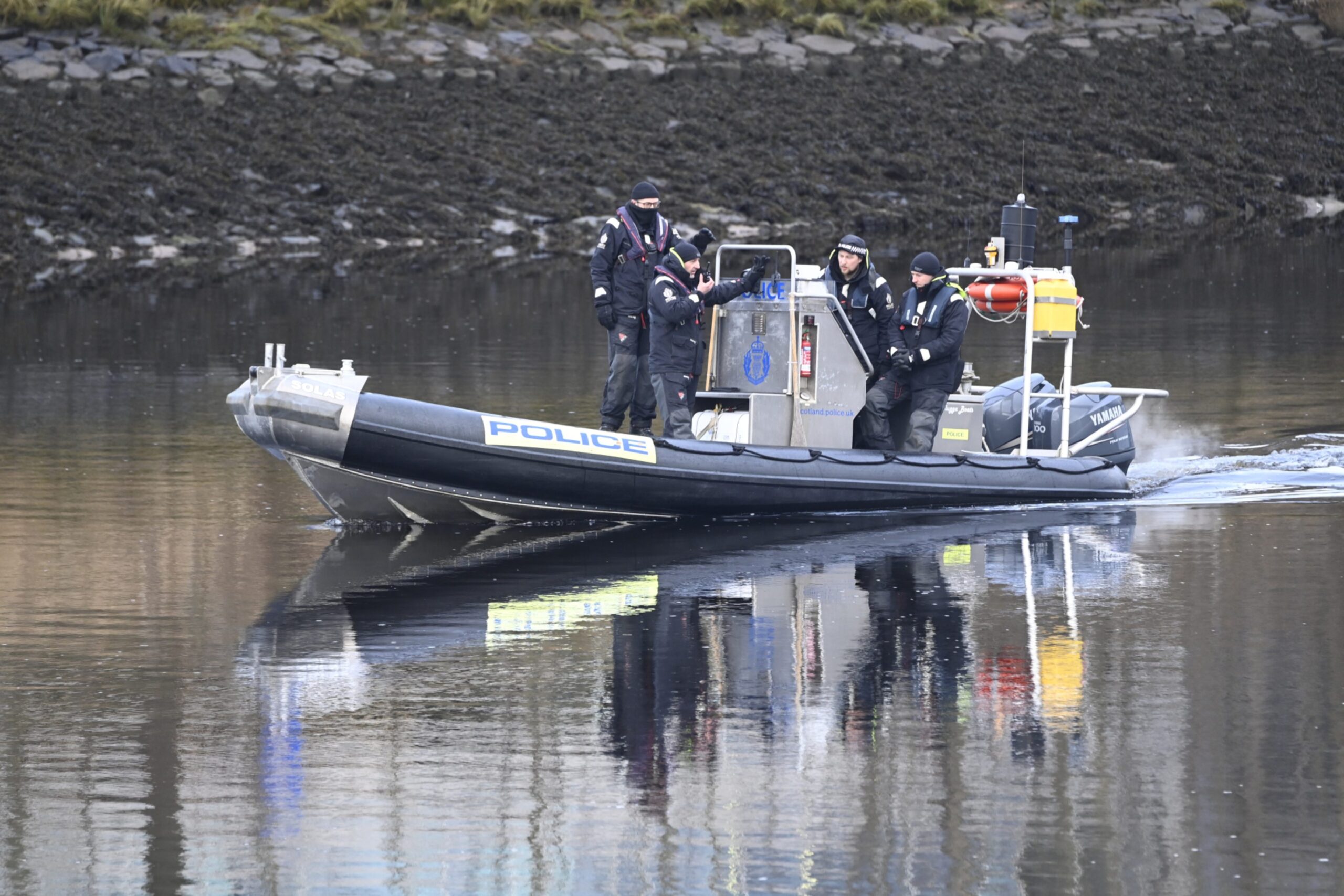 Police at the River Dee this morning, following the recovery of a body in the search for the missing Huszti sisters Eliza and Henrietta Huszti.