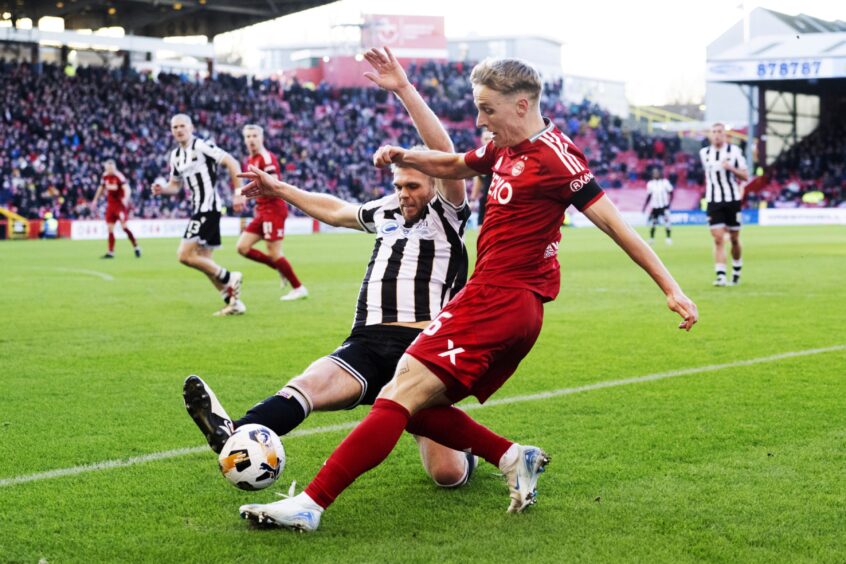 Aberdeen's Jeppe Okkels has a cross from the right wing blocked by St Mirren's Marcus Fraser in action. 