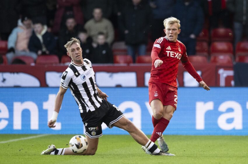 Aberdeen's Alexander Jensen and St Mirren's Killian Phillips in action