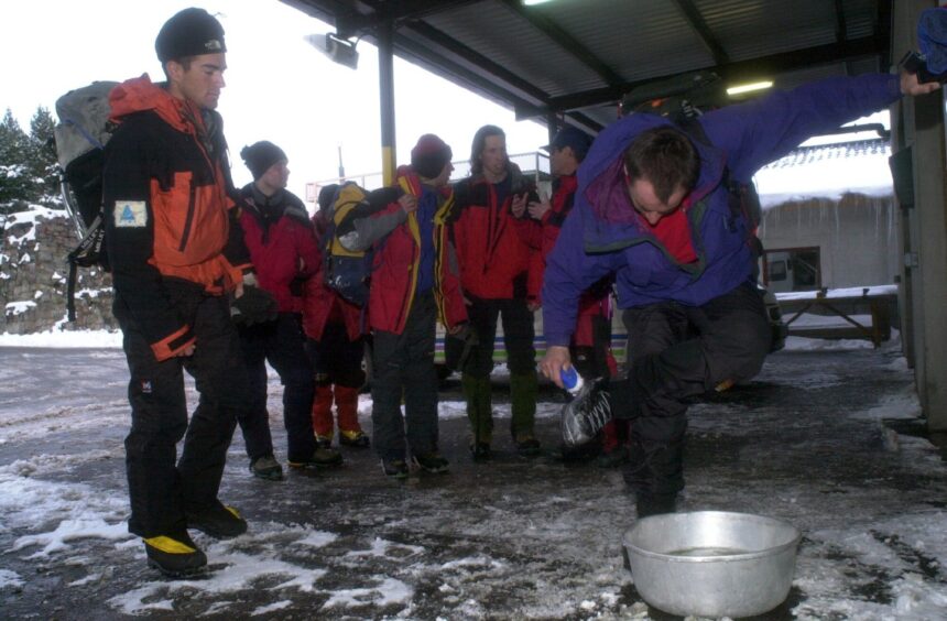 Climbers disinfect their boots at Glenmore Lodge, in the Cairngorms to guard against foot-and-mouth disease in 2001. 