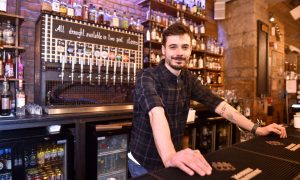 Kyran Wakerell, assistant manager of the Scotch & Rye pub which is approaching its tenth anniversary. Image Sandy McCook/DC Thomson