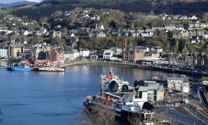 CalMac ferry in Oban Harbour with a view overhead..