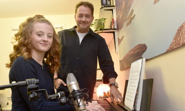 Chris Manning with pupil Sophie Boyne, 13, from Nairn. Image Sandy McCook/DC Thomson