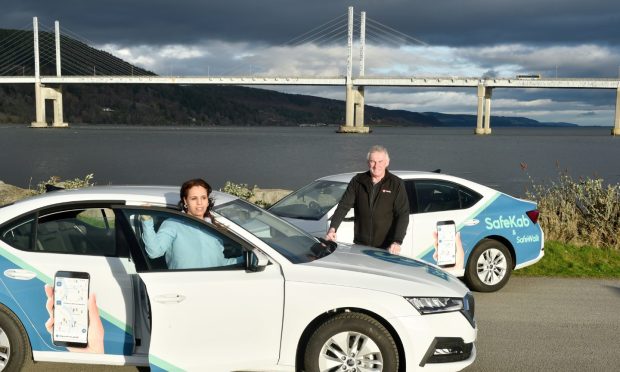 Inverness Taxis owner Gavin Johnston and  SafeKab driver Khadija El Barnaoui. The service is expanding to other areas. Image Sandy McCook/DC Thomson