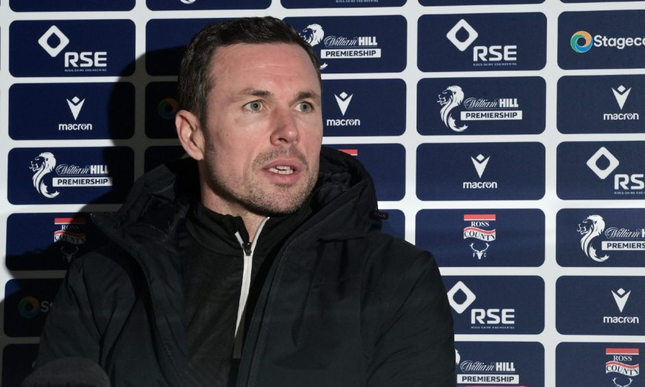 Ross County manager Don Cowie sitting down at a Staggies press conference