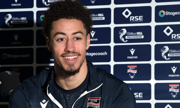 Ross County defender Jonathan Tomkinson smiling during a press conference at Victoria Park.