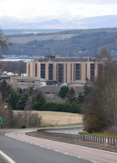 Raigmore Hospital with the A9 in the foreground and Moray Firth Behind.