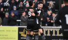 Lewis Hyde, facing, celebrates with Dajon Golding scoring his first Elgin City goal against Peterhead in December. 
Image: Bob Crombie.