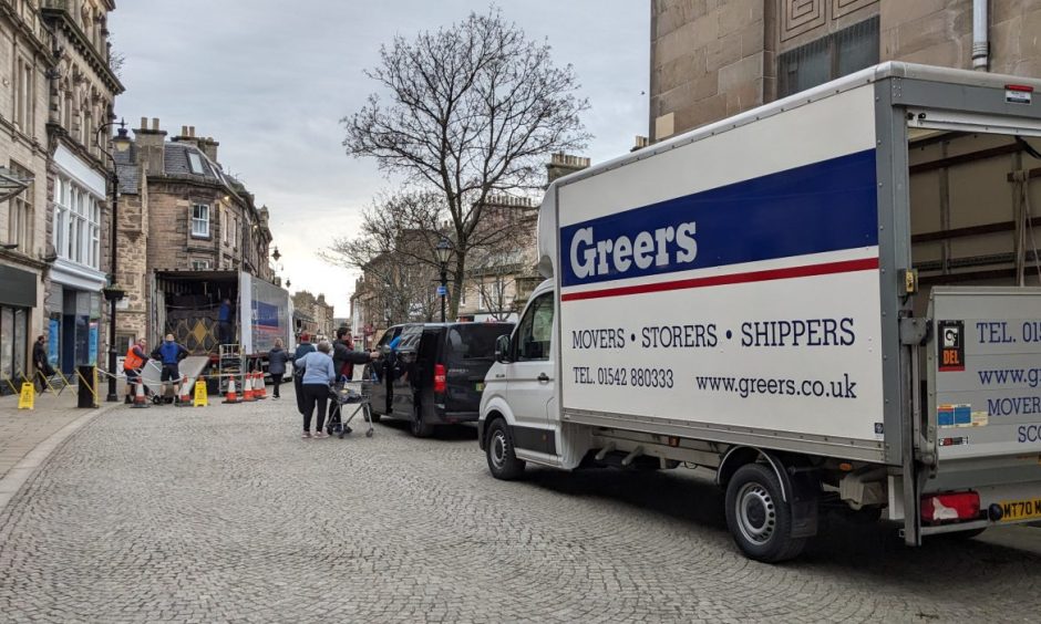 Removal vans outside St Giles Centre. 