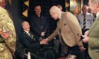 King Charles meets 99-year-old D-Day veteran Jim Glennie, during a visit to the Gordon Highlanders Museum. Image: PA