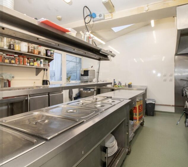 Stainless steel appliances in a commercial kitchen.