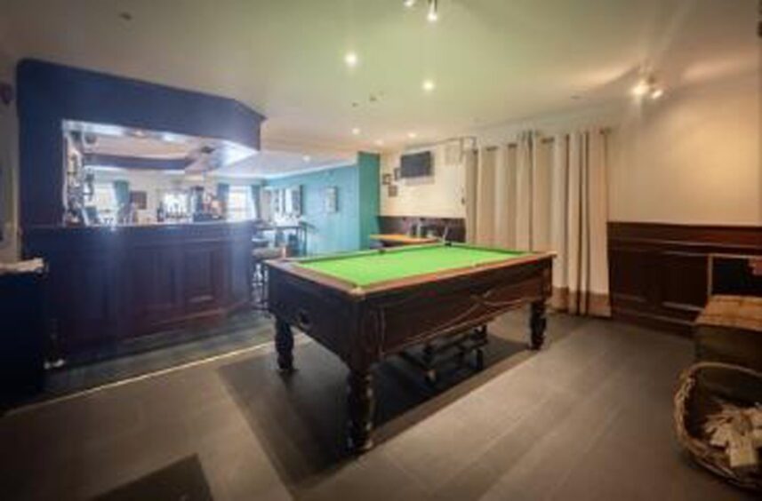 Beyond the bar, lies an elevated platform where punters can find the bar pool table.