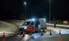 Amey van blocks a junction of the A96 alongside cones and a road closed sign.