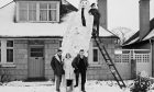 1963: They certainly knew how to build snowmen in 1963, at least Roddy Stuart, his siblings Michael and Leslie, and her boyfriend David Leslie did. Image: DC Thomson