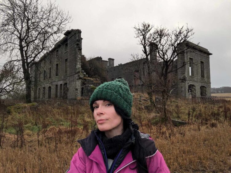 Gayle outside the ruins of Strichen House.