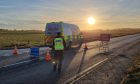 Police at the scene of the A90 crash at Auchiries. Image: Graham Fleming