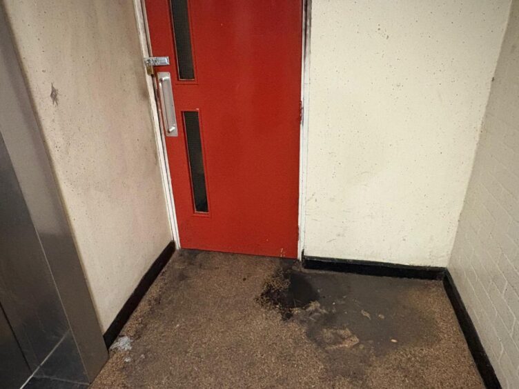 A padlocked door on the landing of Aulton Court, where residents are unable to return to their homes following the fire.