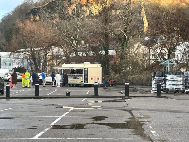 Food van in car park next to Tesco store.