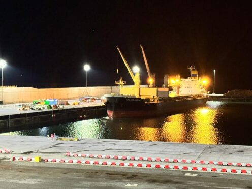 The MV Lowlands Diamond moored at Aberdeen's South Harbour, emergency services to the left.