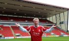 Denis Law at Pittodrie Stadium in 2012. Image: Kath Flannery/DC Thomson.