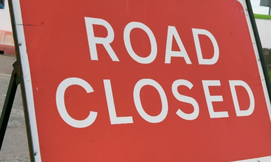 Red road closure sign.