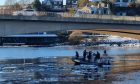 A diving team can be seen on the River Dee near the Queen Elizabeth bridge. Image: Graham Fleming.