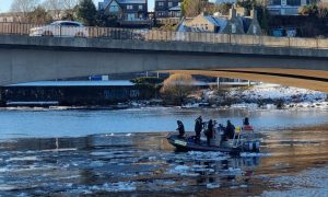 A diving team can be seen on the River Dee near the Queen Elizabeth bridge. Image: Graham Fleming.