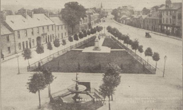 1926: A view of Inverurie's Market Place and memorial garden from the town hall. The fountain is a prominent feature of the foreground. Image: DC Thomson