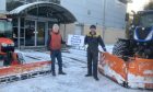 Scott Campbell, right, and his dad, Iain, on snow-ploughing duty.