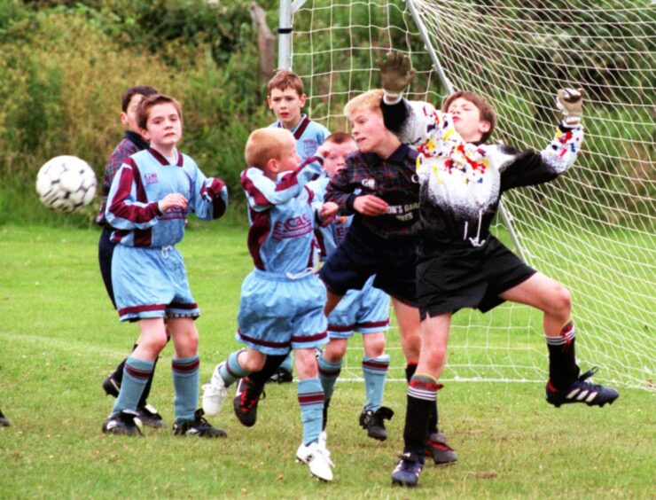 Powis Rebels (light blue) v Cornhill Comets playing a Champion Street match. Image: DCT Archive.