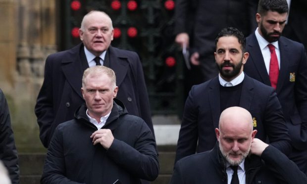 Aberdeen's former Lord Provost Barney Crockett pictured with Manchester United legend Paul Scholes and Ruben Amorim as the group departs Manchester Cathedral after Denis Law's funeral. Image:  Jon Super/Shutterstock