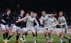 Aberdeen's Mats Knoester, Kristers Tobers and Sivert Heltne Nilsen defend against Dundee. Image: Shutterstock