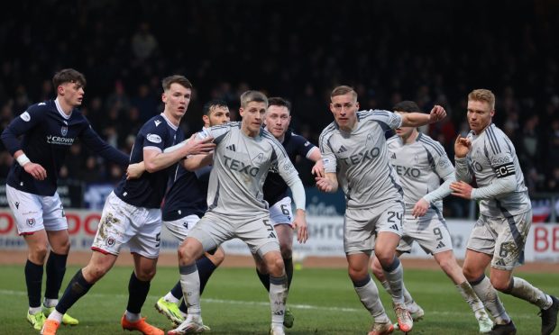 Aberdeen's Mats Knoester, Kristers Tobers and Sivert Heltne Nilsen defend against Dundee. Image: Shutterstock