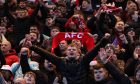 Aberdeen supporters cheer on their team in the 2-1 win against Dundee at Dens Park. Image: Shutterstock