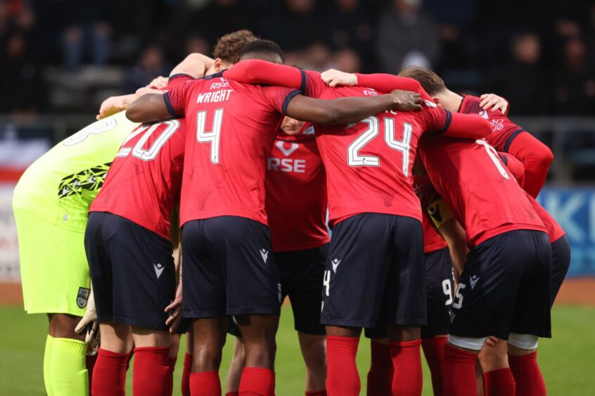 Ross County players in a huddle ahead of a their game against Dundee. 