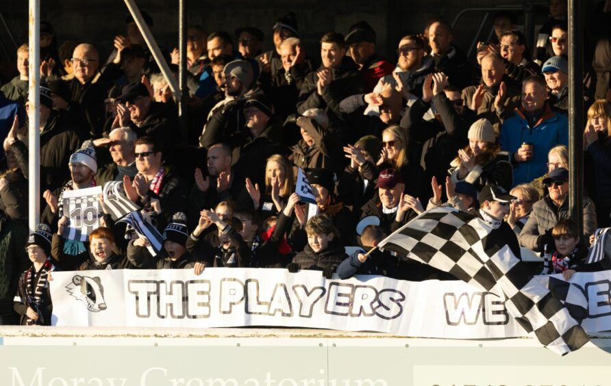 A group of Elgin City fans in the terracing at Borough Briggs.