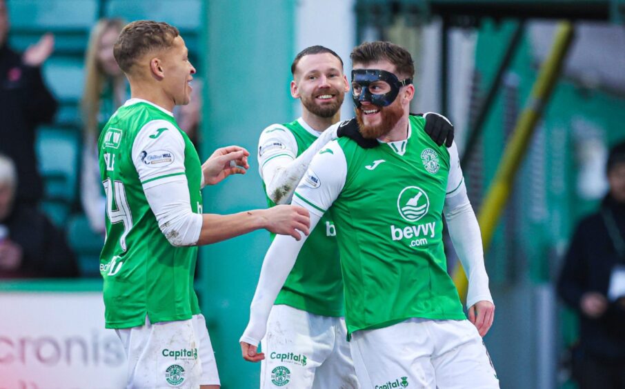 Hibernian's Nicky Cadden (R) celebrates scoring to make it 2-0 with Martin Boyle and Dwight Gayle. Image: SNS.