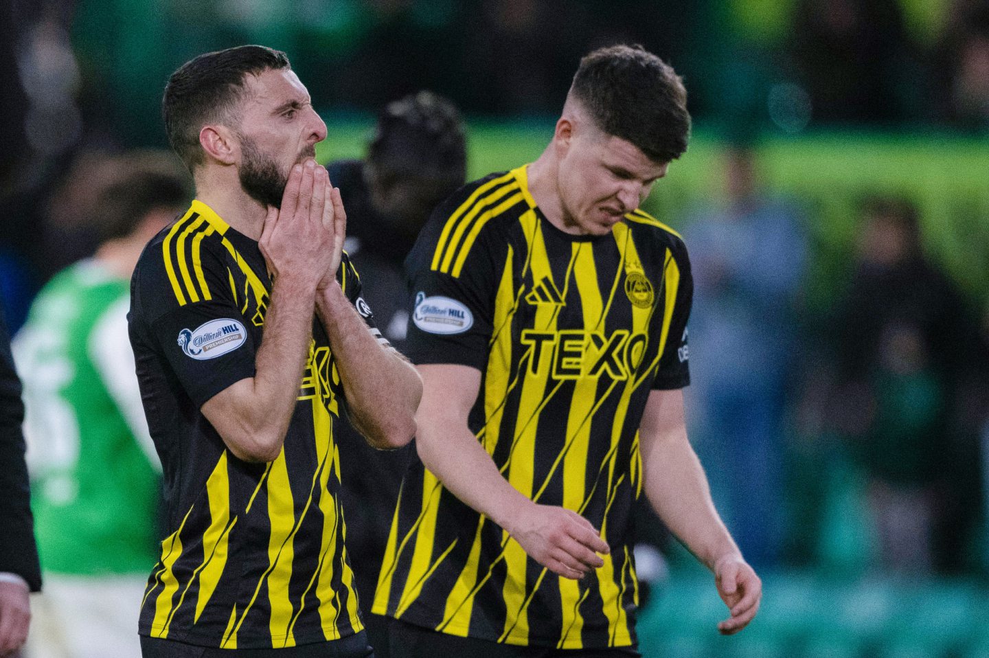 Aberdeen's Graeme Shinnie (L) and Kevin Nisbet look dejected at full-time after the 2-0 loss to Hibs. Image: SNS 