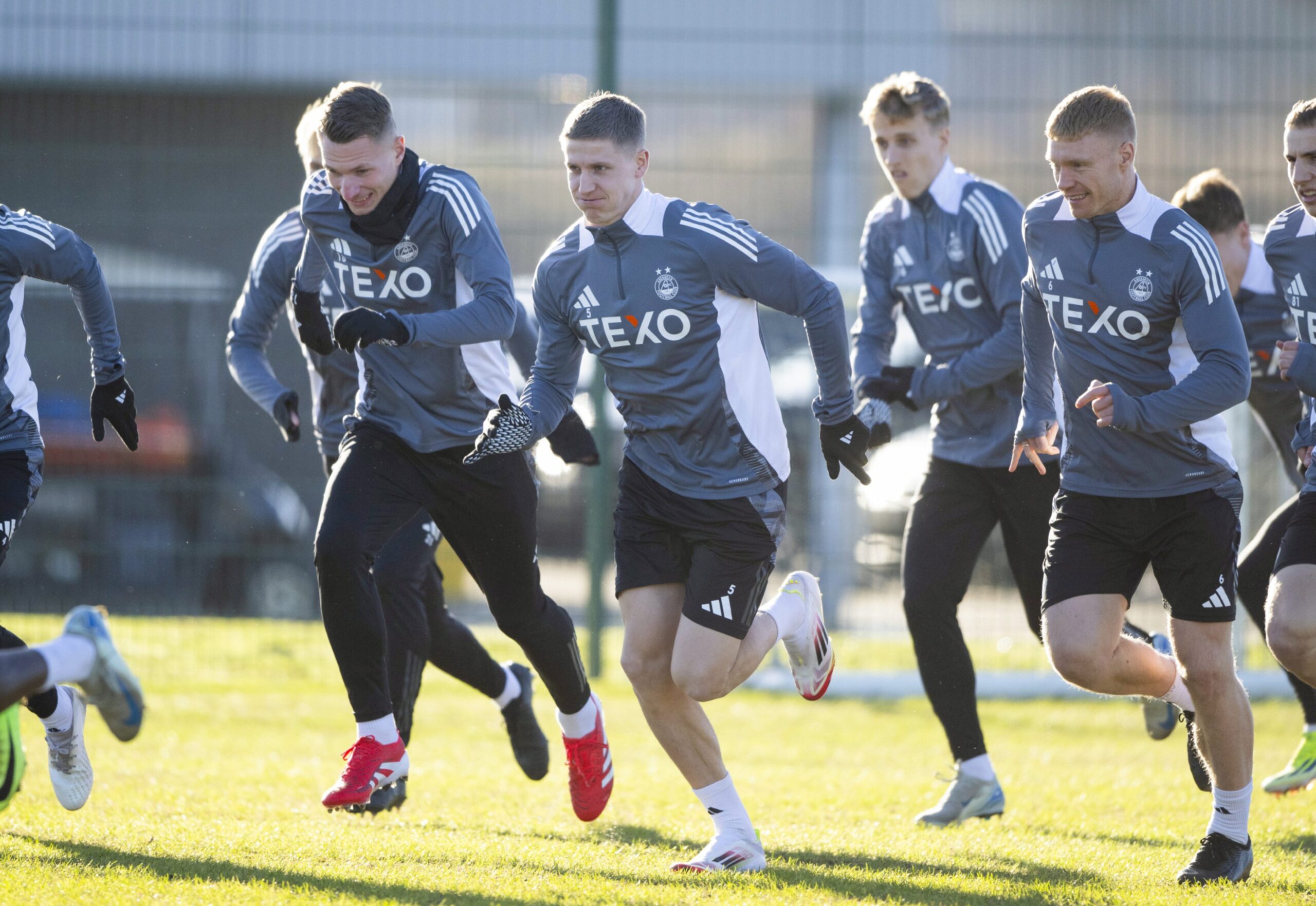 (left to right)Ante Palaversa, new signingMats Knoester and Sivert Heltne Nilsen sprint hard during an Aberdeen training session at Cormack Park.