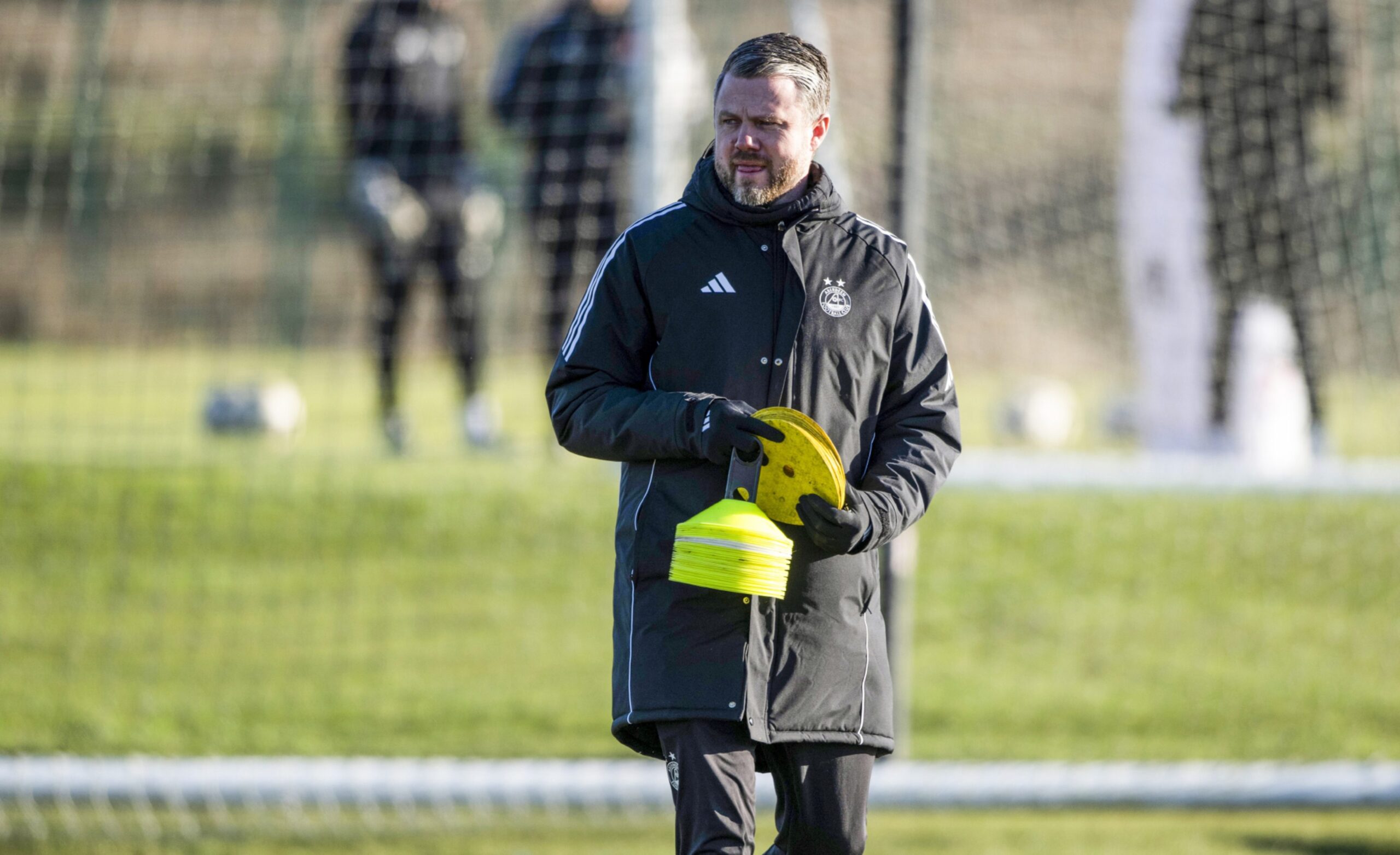 Aberdeen manger Jimmy Thelin puts down training cones at Cormack Park in a session in preparation for the Scottish Cup clash with Dunfermline Athletic.