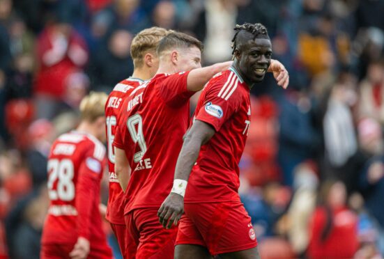 Aberdeen's Pape Habib Gueye celebrates scoring to make it 1-0 against Dunfermline. Image: SNS.