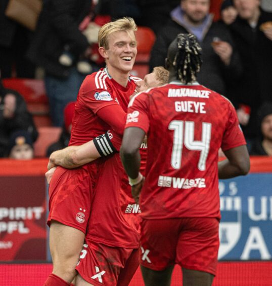 Aberdeen's Alexander Jensen celebrates with his team-mates after scoring against Dunfermline. Image: SNS