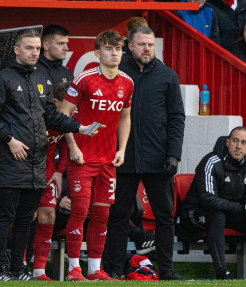 Aberdeen's Fletcher Boyd with head coach Jimmy Thelin during the Scottish Cup match against Dunfermline. Image: SNS.