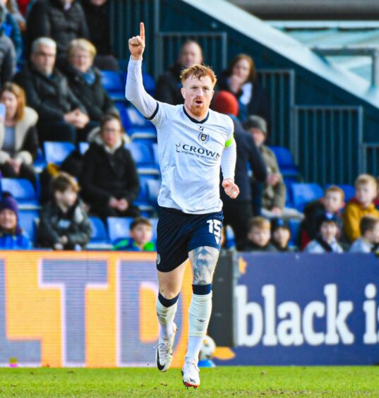 Simon Murray celebrates scoring for Dundee against Ross County.