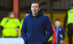 Ross County manager Don Cowie shouts instructions from the touchline.